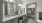 Model bathroom at our senior living apartments in Sugar Land, featuring white countertops and grey cabinetry.